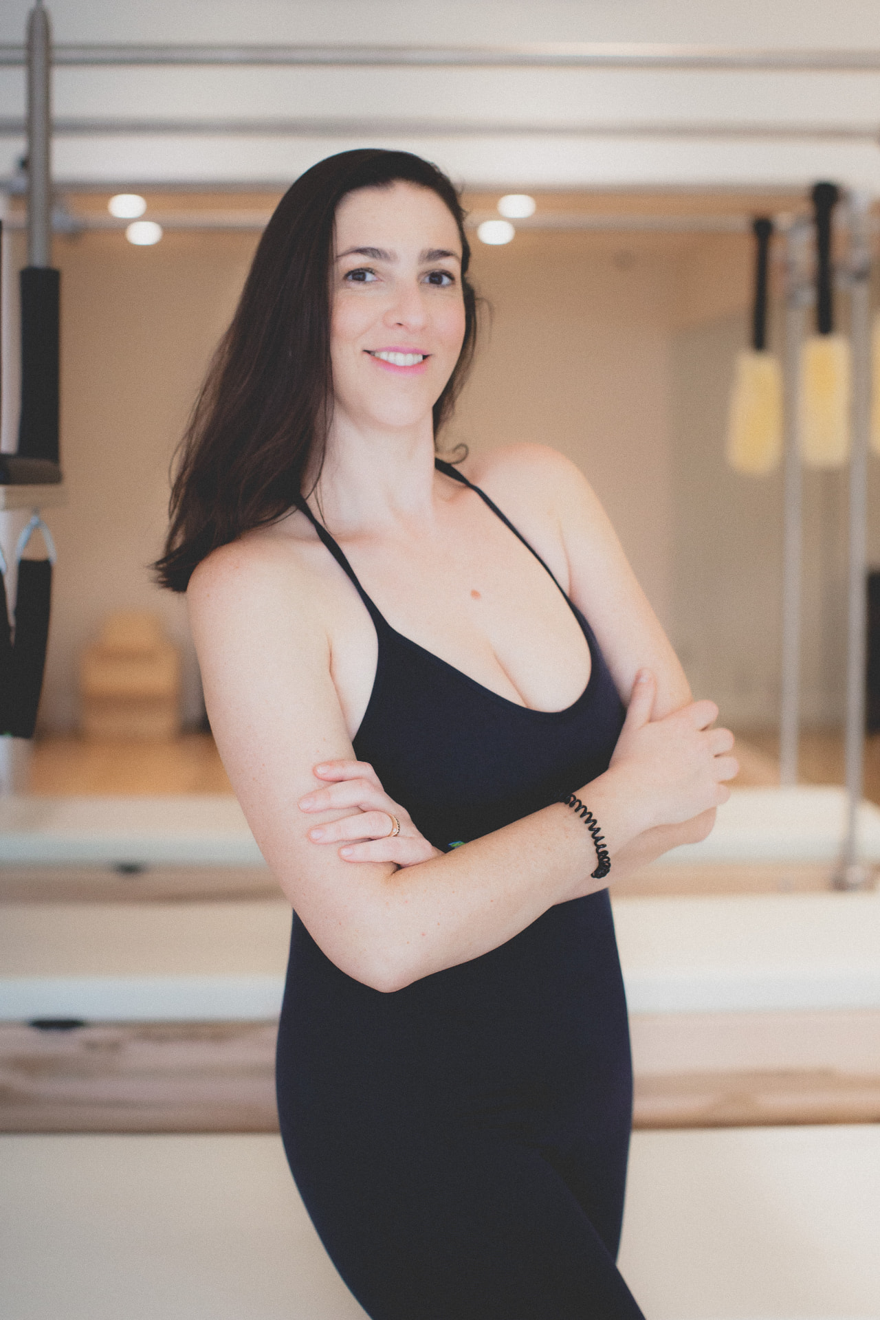 Elina smiling in the studio between apparatus